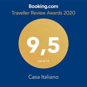 a yellow circle with the number nine and the text travelling review awards at Casa Italiano - BestBnB Garbatella in Rome