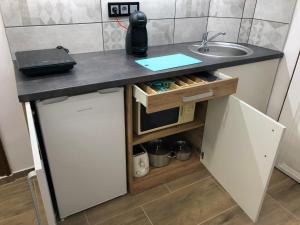 Kuchyň nebo kuchyňský kout v ubytování IL-LAK Apartman