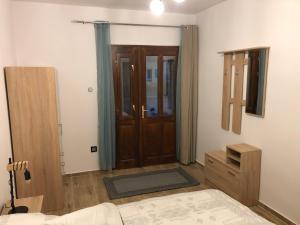 Postel nebo postele na pokoji v ubytování IL-LAK Apartman