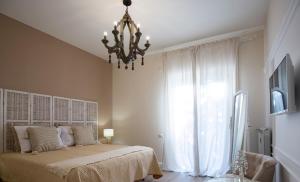 Postel nebo postele na pokoji v ubytování Twins House Sorrento