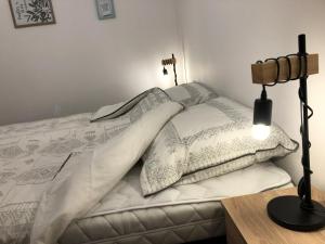 Postel nebo postele na pokoji v ubytování IL-LAK Apartman
