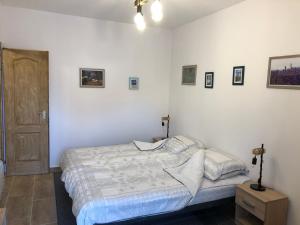 Postel nebo postele na pokoji v ubytování IL-LAK Apartman