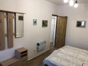 Postel nebo postele na pokoji v ubytování IL-LAK Apartman