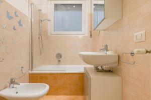a bathroom with a sink and a toilet and a shower at Casa Giulietta in Verona +17 photos