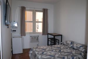 Cama o camas de una habitación en Apartamento aconchegante em Copacabana - unid 503