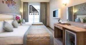 Postel nebo postele na pokoji v ubytování Fatih Hotel Corner