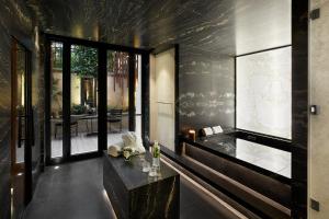 a living room with a table with flowers on it at Maison Villeroy in Paris