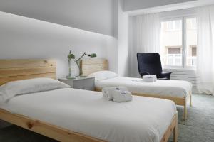 Ένα ή περισσότερα κρεβάτια σε δωμάτιο στο Kimu - Basque Stay