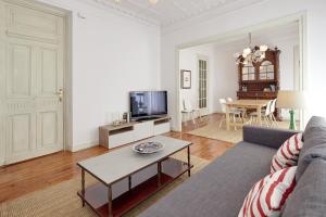 a living room with a couch and a table at Udare - Basque Stay in San Sebasti&aacute;n