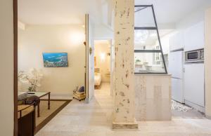a hallway with a living room and a kitchen at BetiJai - Basque Stay in San Sebastián