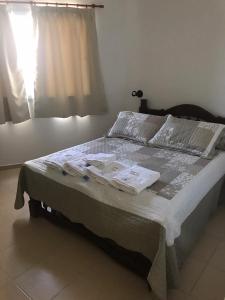 a bed in a bedroom with towels on it at CENTRO RENT APART in Federación