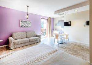 a living room with a couch and a table at Residence Lenno in Lenno