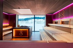 A bed or beds in a room at die HOCHKÖNIGIN - Mountain Resort