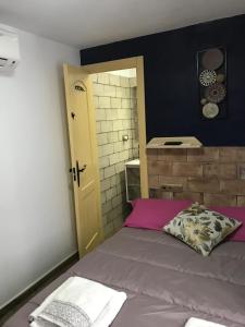 Posteľ alebo postele v izbe v ubytovaní La posada del Cani
