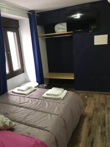 Posteľ alebo postele v izbe v ubytovaní La posada del Cani