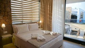 Posteľ alebo postele v izbe v ubytovaní Agnes Deluxe Hotel