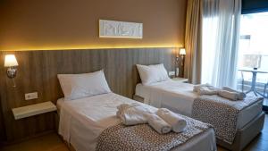 Posteľ alebo postele v izbe v ubytovaní Agnes Deluxe Hotel