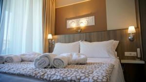 Posteľ alebo postele v izbe v ubytovaní Agnes Deluxe Hotel