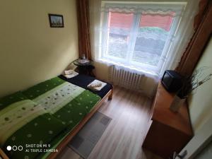 Łóżko lub łóżka w pokoju w obiekcie Apartament-studio, pokoje u Lucy