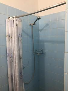 a bathroom with a shower with a shower curtain at Penzion KUDLIK in Rudná pod Pradědem +61 photos