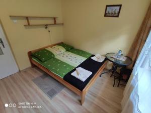 Łóżko lub łóżka w pokoju w obiekcie Apartament-studio, pokoje u Lucy