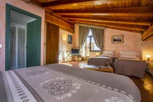 a bedroom with two beds in a room at Hotel Chalet Joli in Courmayeur