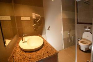 Koupelna v ubytování Hotel Ami Grace