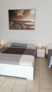 A bed or beds in a room at Residence Hotel Vittoria
