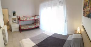 A bed or beds in a room at Residence Hotel Vittoria