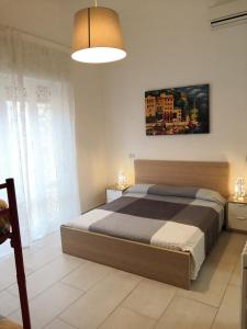 A bed or beds in a room at Residence Hotel Vittoria