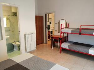 A bed or beds in a room at Residence Hotel Vittoria