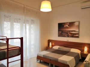 A bed or beds in a room at Residence Hotel Vittoria