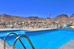 a swimming pool with a view of a city at Harmony apartment in Mindelo São Vicente in Mindelo