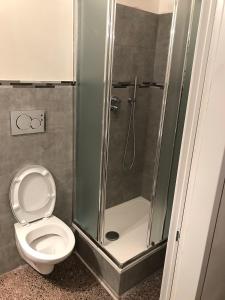 a bathroom with a shower and a toilet at A Casa Di Giallo B&B in Rome