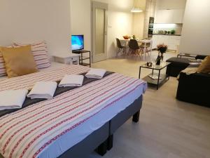 Postel nebo postele na pokoji v ubytování Prima Family Apartments