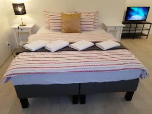 Postel nebo postele na pokoji v ubytování Prima Family Apartments