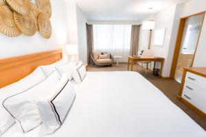 Rúm í herbergi á Hotel Melia Lima