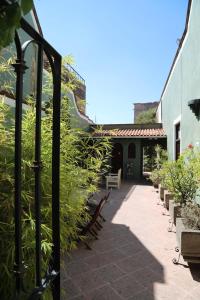 a walkway leading to an outdoor patio area at La Casa del Atrio in Querétaro