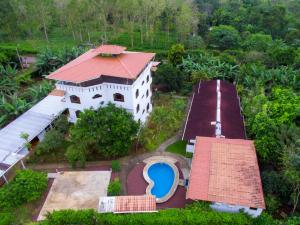 an aerial view of a house with a red roof at Hotel Twin Galápagos in Puerto Ayora