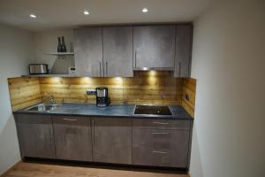 Kuchyň nebo kuchyňský kout v ubytování Ferienwohnung Stuimändle