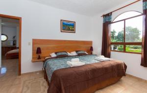 Postel nebo postele na pokoji v ubytování Hotel Twin Galápagos