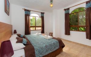 Postel nebo postele na pokoji v ubytování Hotel Twin Galápagos