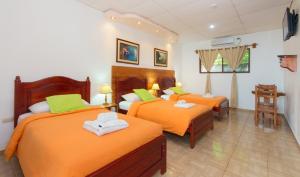 Postel nebo postele na pokoji v ubytování Hotel Twin Galápagos
