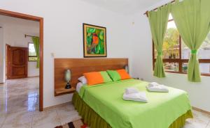 Postel nebo postele na pokoji v ubytování Hotel Twin Galápagos
