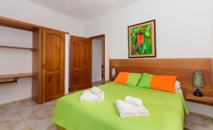 Postel nebo postele na pokoji v ubytování Hotel Twin Galápagos
