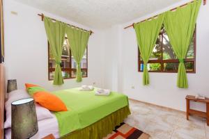 Postel nebo postele na pokoji v ubytování Hotel Twin Galápagos