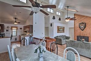 a kitchen and living room with a table and chairs at Lake Harmony Home Near Big Boulder Ski Area! in Lake Harmony