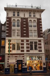 a building on the corner of a street at Hotel Jimmy in Amsterdam