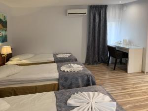 Postel nebo postele na pokoji v ubytování A1 Hotel Riga City Center
