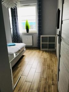 Posteľ alebo postele v izbe v ubytovaní Apartament Calamo Tuwima Park